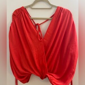 Free people size medium silky blouse, back ties